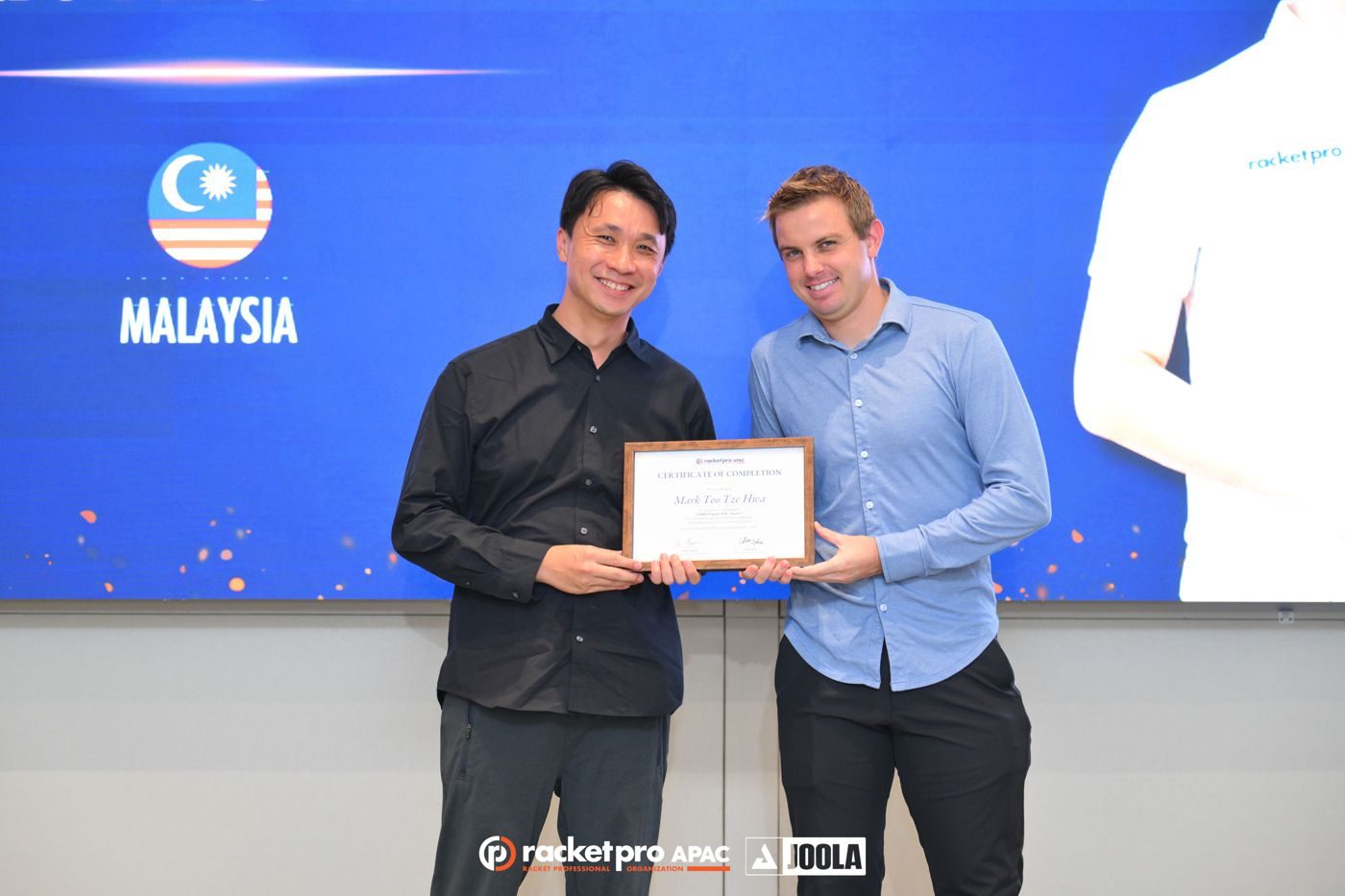 Mark Teo receiving COEBRA recognition from Collin Johns at RPO APAC
